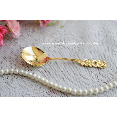 Vintage sugar spoon metal in golden color