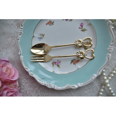 Vintage spoon and fork pair in golden color