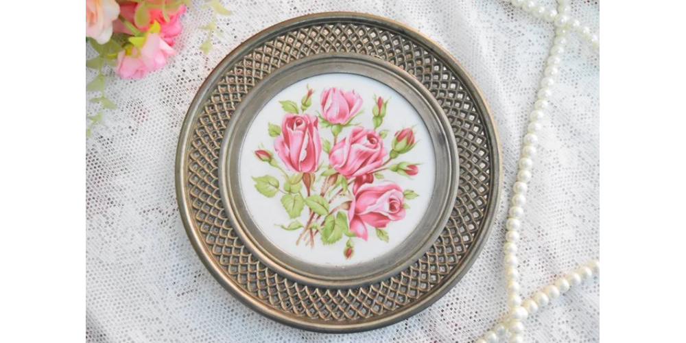Vintage perfored metal and porcelain plate