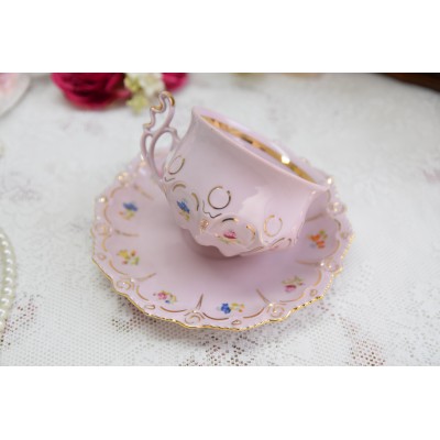Pink porcelain teacup and saucer