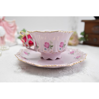Pink porcelain coffee cup and saucer