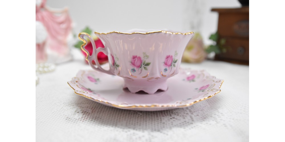 Pink porcelain coffee cup and saucer