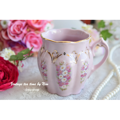 Pink porcelain mug with white and pink flowers