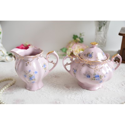 Pink porcelain milk jug and sugar bowl set