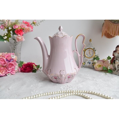 Pink porcelain coffee pot with pink flowers