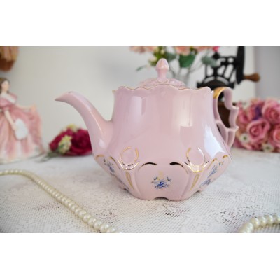 Pink porcelain teapot with blue flowers